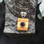 Garnet set in Huon Pine & Blackwood Pendant by Belle