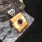 Garnet set in Huon Pine & Blackwood Pendant by Belle