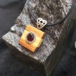 Garnet set in Huon Pine & Blackwood Pendant by Belle
